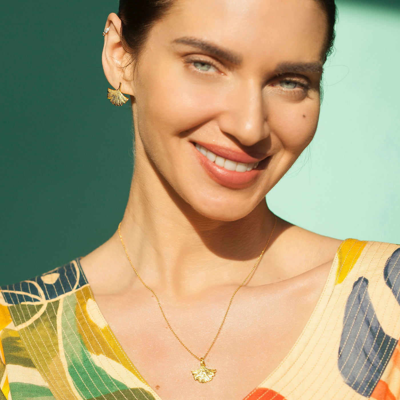 Model Wearing Ginkgo Leaf Necklace Pendant In Gold
