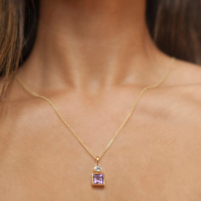 Gold Pendant With Natural Amethyst And Blue Topaz Gemstones on Model