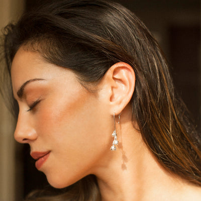 Leaf Drop Earrings In Silver on Model