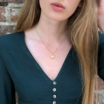 Model Wearing Gold and White Topaz Sun Necklace