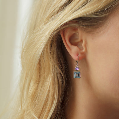 Model Wearing Silver Earrings with Blue Topaz and Amethyst