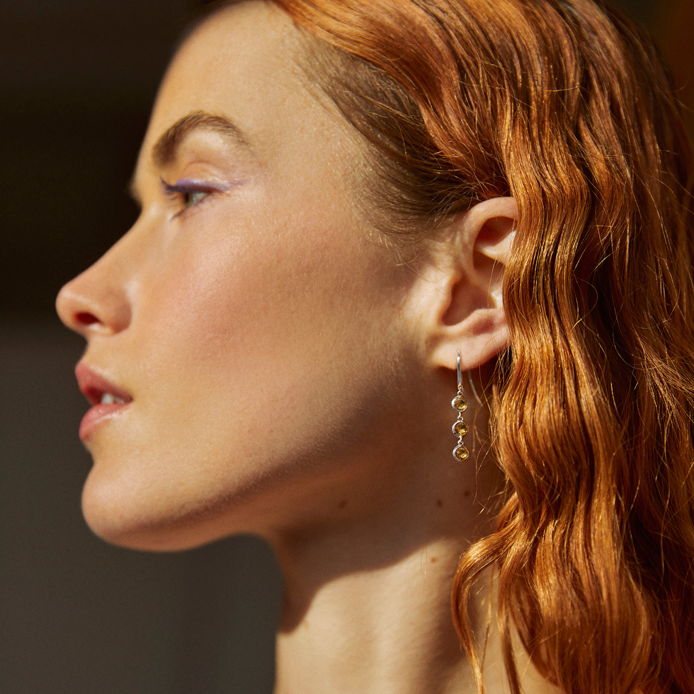 Model with Side View of Silver and Triple Cognac Quartz Drop Earrings