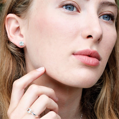 Model Wearing White Topaz and Silver Gem Squared Stud Earrings
