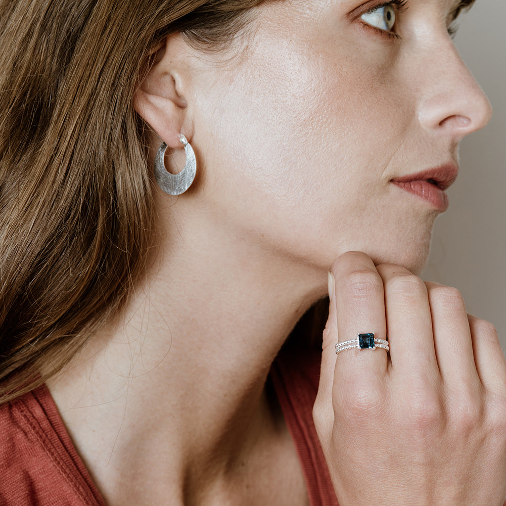 Model Wearing Small Crescent Hoop Polished Silver Earrings